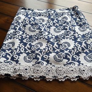 Worn once- like new navy and white skirt with pretty lace edging. Lined.